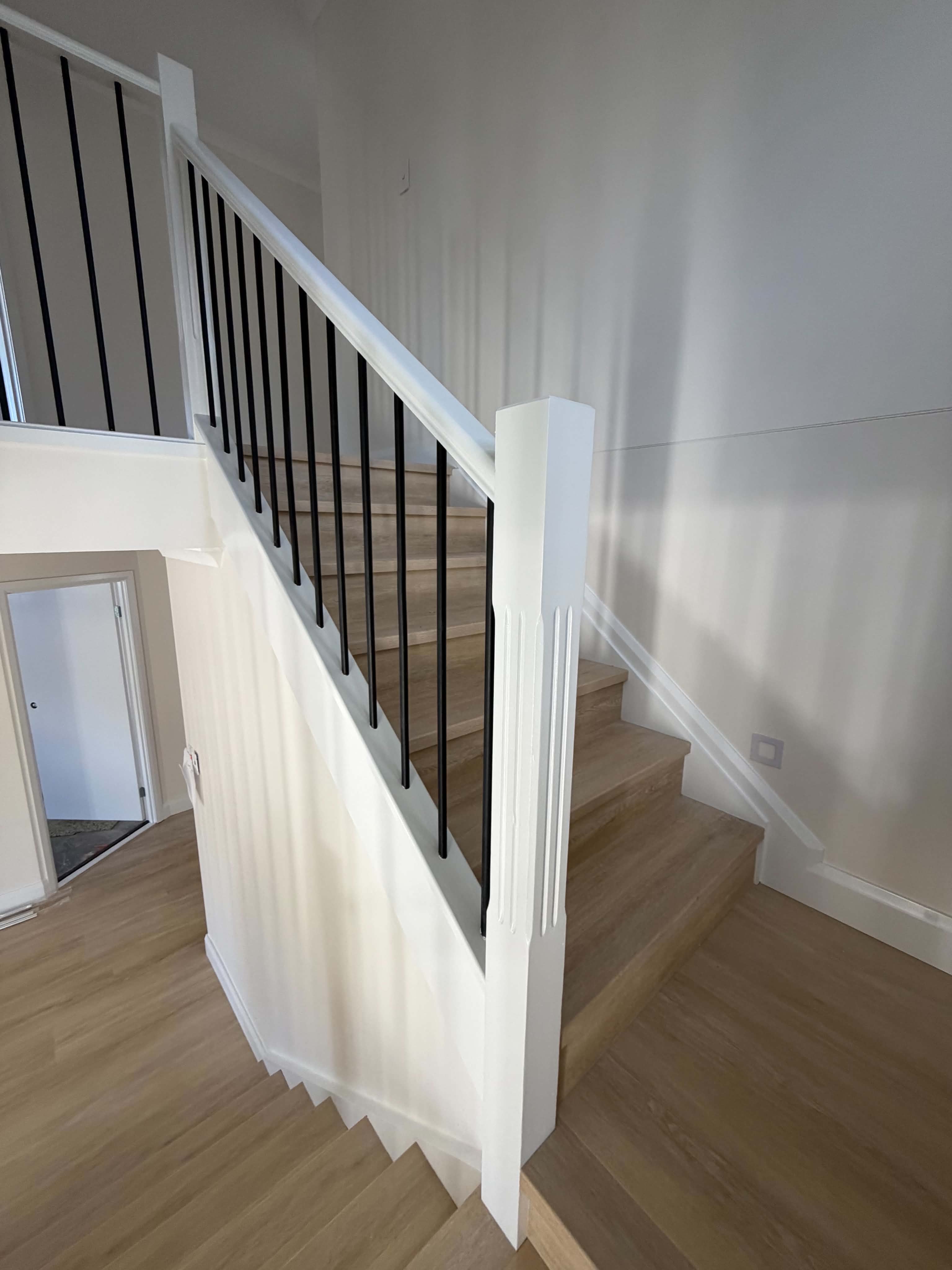 Clean white staircase and balustrade finish